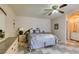 Comfortable bedroom with a queen bed and a ceiling fan at 6520 Turtle Hill Rd, Las Vegas, NV 89110