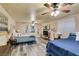 Spacious bedroom with dual beds, ceiling fan, and ample natural light at 6520 Turtle Hill Rd, Las Vegas, NV 89110