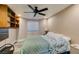 Cozy bedroom with a comfortable bed, built-in shelves, and natural light at 6520 Turtle Hill Rd, Las Vegas, NV 89110