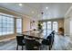 Dining room with large table, neutral walls, and ample natural light at 6520 Turtle Hill Rd, Las Vegas, NV 89110