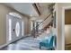 Front entryway with white door, gray flooring, and view of staircase at 6520 Turtle Hill Rd, Las Vegas, NV 89110