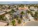 Aerial view of a two-story home with a stone facade, well-manicured landscaping, and a gated entrance at 6520 Turtle Hill Rd, Las Vegas, NV 89110