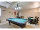 Spacious game room with a pool table, foosball table, and poker table, perfect for entertaining guests at 6520 Turtle Hill Rd, Las Vegas, NV 89110
