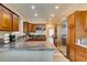 Kitchen showcasing wood cabinets, granite countertops, stainless steel appliances, and ample counter space at 6520 Turtle Hill Rd, Las Vegas, NV 89110