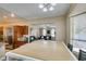 Open concept kitchen with stainless steel appliances, granite countertops, and seamless flow into the living room at 6520 Turtle Hill Rd, Las Vegas, NV 89110