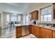 Kitchen view of stainless steel appliances, granite countertops, wood cabinets, and eat-in kitchen at 6520 Turtle Hill Rd, Las Vegas, NV 89110