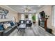 Open living area featuring gray flooring, fireplace, and plush sofas at 6520 Turtle Hill Rd, Las Vegas, NV 89110