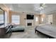 Spacious main bedroom with fireplace, television, and doorway to the main bath at 6520 Turtle Hill Rd, Las Vegas, NV 89110