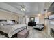 Well-lit main bedroom with fireplace, television, and doorway to the main bath at 6520 Turtle Hill Rd, Las Vegas, NV 89110