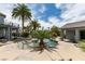 Serene backyard featuring a custom pool, lush palm trees, and a tranquil seating area at 6520 Turtle Hill Rd, Las Vegas, NV 89110