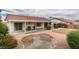 The backyard features gravel landscaping, a covered patio, and a seating area at 709 Heritage Point Dr, Henderson, NV 89002