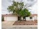 Inviting single-Gathering home with desert landscaping, mature trees, and a tile roof at 709 Heritage Point Dr, Henderson, NV 89002