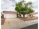 Charming single-story home with a well-maintained front yard and attached two-car garage at 709 Heritage Point Dr, Henderson, NV 89002