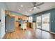Well-lit kitchen has stainless appliances, sliding glass door, and an island at 709 Heritage Point Dr, Henderson, NV 89002