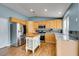 Bright kitchen showcases stainless steel appliances, granite countertops, and natural wood cabinetry at 709 Heritage Point Dr, Henderson, NV 89002