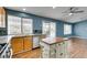 Updated kitchen with stainless steel appliances, an island and a view to the backyard at 709 Heritage Point Dr, Henderson, NV 89002