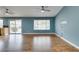 Open-concept living area with wood-look flooring and a sliding glass door leading to the backyard at 709 Heritage Point Dr, Henderson, NV 89002
