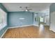 Bright living room boasts wood floors, ceiling fan, and abundant natural light at 709 Heritage Point Dr, Henderson, NV 89002