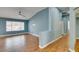 Bright living room with wood-look flooring, neutral walls, and ample natural light at 709 Heritage Point Dr, Henderson, NV 89002