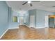 Open living space with wood-look flooring, neutral paint, and a view into the entryway at 709 Heritage Point Dr, Henderson, NV 89002