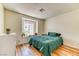Spacious bedroom with natural light, a large window seat, and hardwood floors at 7200 Pirates Cove Rd # 2071, Las Vegas, NV 89145