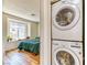 View of bedroom with window and modern washer/dryer at 7200 Pirates Cove Rd # 2071, Las Vegas, NV 89145