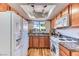 Bright kitchen featuring granite countertops and modern appliances at 7200 Pirates Cove Rd # 2071, Las Vegas, NV 89145