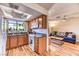 Cozy kitchen featuring granite countertops, a window over the sink, and a dining area at 7200 Pirates Cove Rd # 2071, Las Vegas, NV 89145