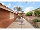 A large backyard with a covered patio and drought-tolerant landscaping at 7517 Elk Meadows Ct, Las Vegas, NV 89131
