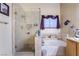 This bathroom features a glass shower, built in niche, and a bathtub at 7517 Elk Meadows Ct, Las Vegas, NV 89131