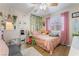This bedroom features decor, natural light, and hardwood floors at 7517 Elk Meadows Ct, Las Vegas, NV 89131
