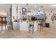 Spacious open kitchen with bar seating, gray cabinets, and modern design at 7517 Elk Meadows Ct, Las Vegas, NV 89131
