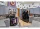 Kitchen with stainless steel appliances, gray cabinets, and granite countertops at 7517 Elk Meadows Ct, Las Vegas, NV 89131