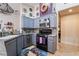 Cozy kitchen features gray cabinetry, granite countertops, and modern appliances at 7517 Elk Meadows Ct, Las Vegas, NV 89131