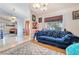 Comfortable secondary living room with natural light, durable floors, and warm decorations at 7517 Elk Meadows Ct, Las Vegas, NV 89131