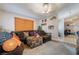 A spacious living room with vaulted ceilings, a comfortable couch, and soft, neutral carpet at 7517 Elk Meadows Ct, Las Vegas, NV 89131