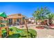 Expansive backyard featuring custom playset, artificial turf, patio, and plenty of space for outdoor activities at 7902 Jessamy St, North Las Vegas, NV 89084