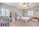 Bright bedroom featuring two windows and plush carpet at 7902 Jessamy St, North Las Vegas, NV 89084