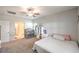 Cozy bedroom with ceiling fan and carpeted floors at 7902 Jessamy St, North Las Vegas, NV 89084