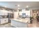 Bright kitchen with granite counters, stainless appliances and white cabinets at 7902 Jessamy St, North Las Vegas, NV 89084