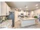 Bright kitchen featuring a large island, stainless appliances and neutral walls at 7902 Jessamy St, North Las Vegas, NV 89084