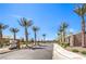 Welcome to the community with a street view of palm trees and signage at 7902 Jessamy St, North Las Vegas, NV 89084