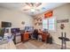 Home office with multiple monitors, desk, and comfortable seating at 7902 Jessamy St, North Las Vegas, NV 89084