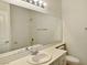 Clean bathroom with a wide mirror, vanity, and tub-shower combination at 8084 Black Orchid Ave, Las Vegas, NV 89131
