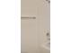 A close-up of a clean, white bathroom featuring a shower and a tub at 8084 Black Orchid Ave, Las Vegas, NV 89131