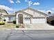 Charming single-story home featuring a three-car garage and well-maintained landscaping at 8084 Black Orchid Ave, Las Vegas, NV 89131