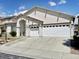 Attractive single-story home with a three-car garage, manicured lawn, and inviting entrance at 8084 Black Orchid Ave, Las Vegas, NV 89131