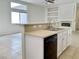 Updated kitchen with stainless steel appliances, breakfast bar, and built-in shelving at 8084 Black Orchid Ave, Las Vegas, NV 89131