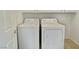 Bright laundry area with washer and dryer, and tiled flooring at 8084 Black Orchid Ave, Las Vegas, NV 89131