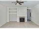 Cozy living room featuring a fireplace, decorative mantle, and tile flooring at 8084 Black Orchid Ave, Las Vegas, NV 89131